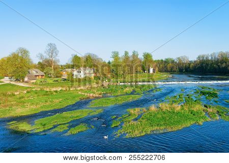 Landscape With Ventas Rumba Waterfall In Kuldiga In Kurzeme In Western Latvia. The City Used To Be C