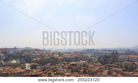 Scenic View Of Porto, Portugal From The Tower Clérigos Church. Orange Roofs Of The Houses. Popular T