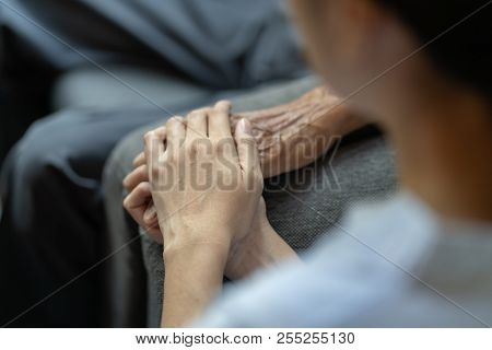 Hand Of Younger Woman Holding Hand Elderly Man, Helping Hands, Take Care For Elderly Concept.