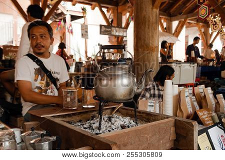 Chiang Mai, Thailand - December 8, 2017: Vendor Of Coffee And Coffee Makers On A Street Market.