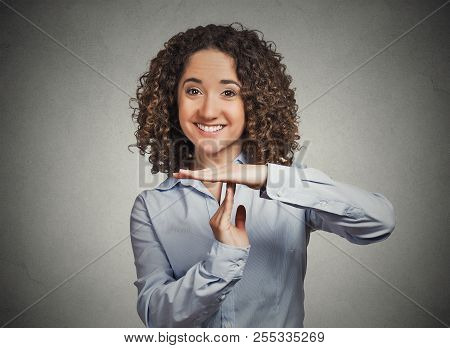 Closeup Portrait Young Happy, Smiling Woman Showing Time Out Gesture With Hands, Isolated Grey Wall 