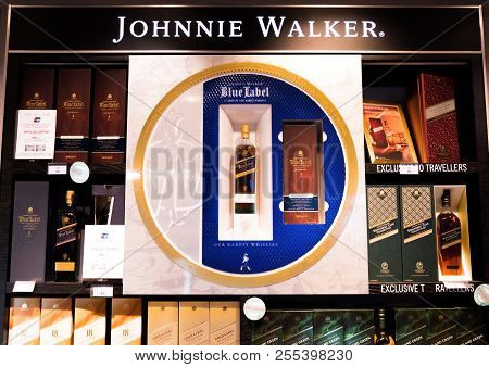 London, Uk - August 31, 2018: Johnnie Walker Whiskey Bottles On Shelf With Display Logo In Luxury Li
