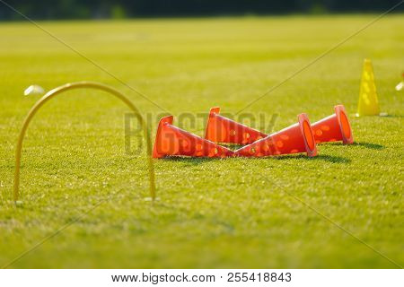 Football Training Equpment On Practice Session. Soccer Equipment In Empty Soccer Pitch