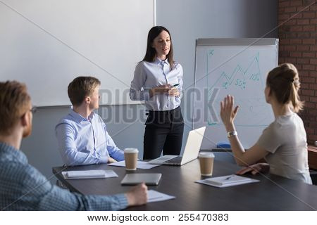 Female Employee Asking Question To Business Speaker During Metin