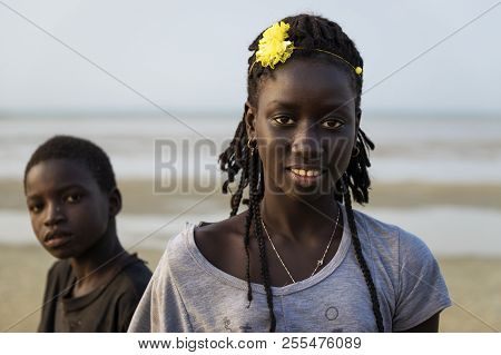 Orango Island, Guinea-bissau - February 2, 2018:  Portrait Of A Beautiful Young Girlr And A Boy In T