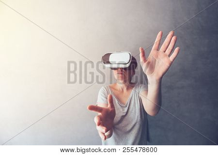 Woman Immersed In Virtual Reality, Female Person Using Modern Vr Headset To Experience 3d Multimedia