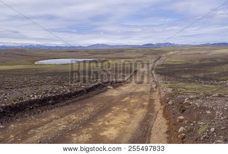 Dirt Mountain Road In Abandoned Green Landscape At Nature Reserv
