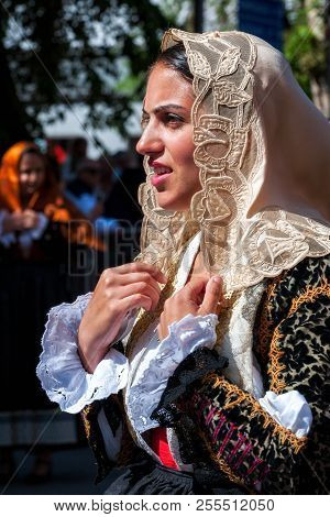 Sardinia, Italy. Feast Of The Redeemer, Traditional Costumes Parade.