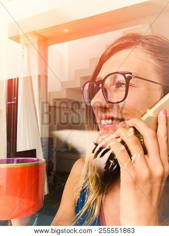 Woman Talking On The Cellphone And Drinking Coffee Iside The Apartment - Window, Glass, Reflection.