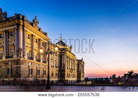 Royal Palace In Madrid, Spain, In A Beautiful Sunset A Summer Day. Long Exposure People Blurred