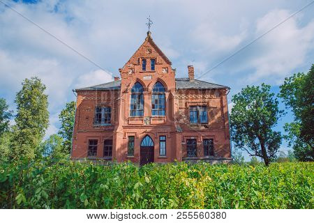 Old Manor House And Meadow, Green Trees. Travel Photo 2018.