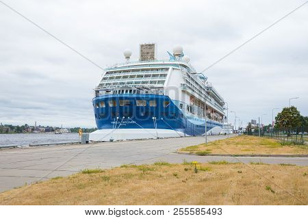 Big Ship At Riga Port. Urban City View.