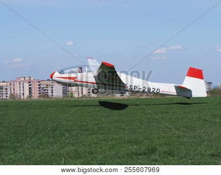 Bielsko-biala, Poland On April 2018: Szd-9bis Bocian Sp-2820 P-702 Glider Takes Off From Green Grass