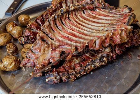 Many Cooking Traditional Turkish Roasting Lamb Barbecues.roasted Meat Over An Open Fire, Cooked In A