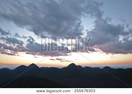 A Beautiful Sunset Sky With Silhouette Mountain