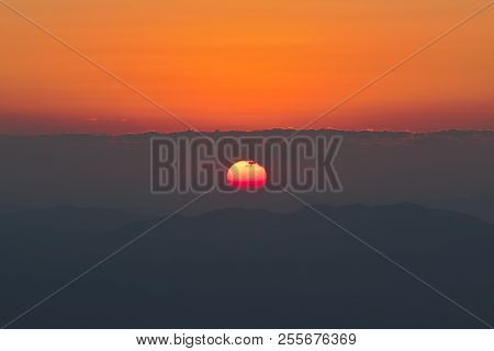 Beautiful Sunrise On Mountain With Red Sky Background