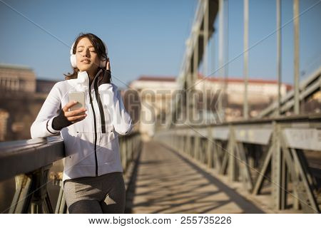 Young Athlete Woman With Mobile Phone Outdoor