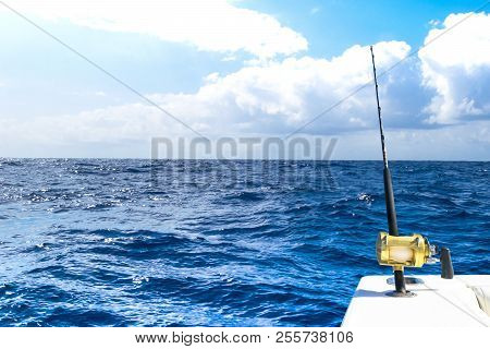 Fishing Rod In A Saltwater Private Motor Boat During Fishery Day In Blue Ocean. Successful Fishing C