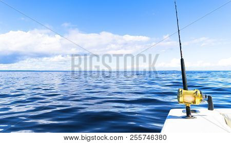 Fishing Rod In A Saltwater Private Motor Boat During Fishery Day In Blue Ocean. Successful Fishing C