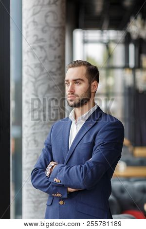 A Man Is Dressed In An Official Suit