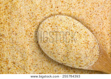 Polenta, yellow Cornmeal flour, Semolina, fast cooking closeup texture of grains