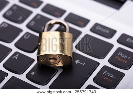 Close Up Of A Padlock On Laptop Keypad