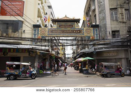 Thanon Ratchawong Road With Traffic At Front Of Wat Loka Nu Khro At Samphanthawong In Bangkok, Thail