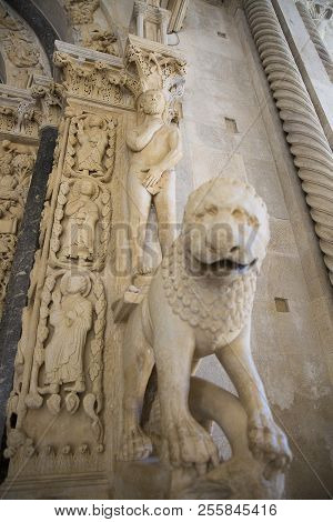 Statue Of Adam And A Lion At Entrance Of West Portal Of Saint Lawrence Cathedral Or Katedrala Sv. Lo