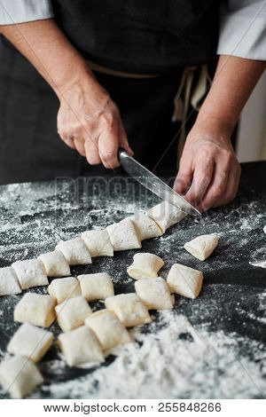 Slow Motion Of Female Cook Hands Cut The Dough Into Pieces With A Kitchen Knife