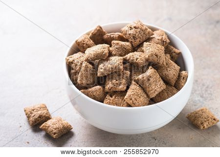 Chocolate Pillows In White Bowl. Close Up. Healthy Cereal Breakfast.