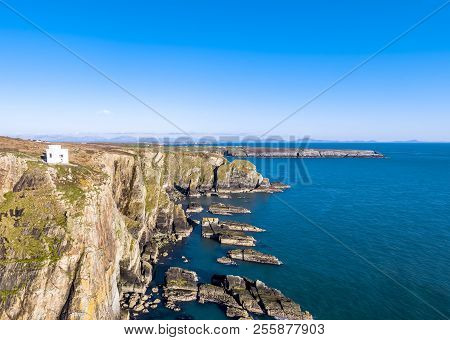 Aerial View Of The Beautiful Cliffs Close To The Historic South Stack Lighthouse On Anglesey - Wales