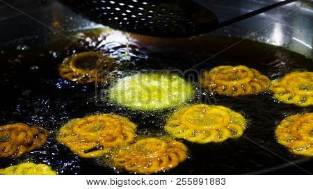 Jalebi An Indian Sweet Dish Being Fried In Sugar Syrup In A Large Container