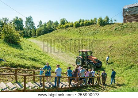 Riding A Large Wheeled Tractor At The Regional Festival-fair Luk-luchok August 25, 2018 In The City
