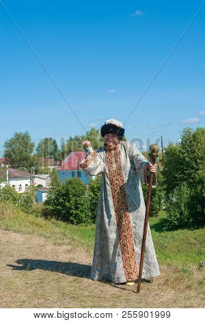 A Woman In Russian Clothes And A Staff At The Regional Festival-fair Luk-luchok August 25, 2018 In T