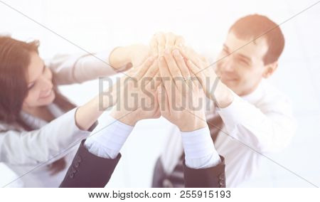 friendly business team holding hands