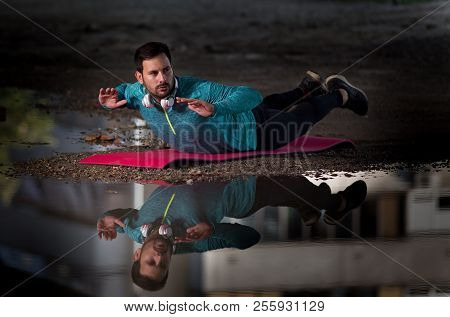 Man Doing Back Extension Outdoor