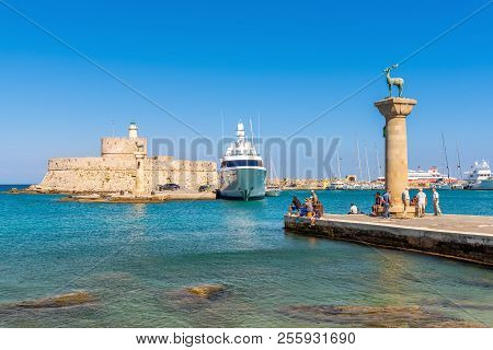 Rhodes, Greece - May 13, 2018: Entrance To The Mandraki Port Of Rhodes In Sunny Day.