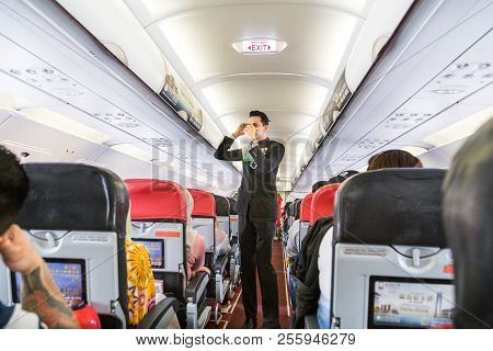 Kuala Lumpur, Malaysia, August 20, 2018: Series Of Steward Demonstrating Safety Prosedure Prior To C