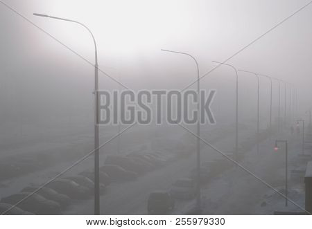 Fog In The City. Landscape With A Street Enveloped In Thick Fog