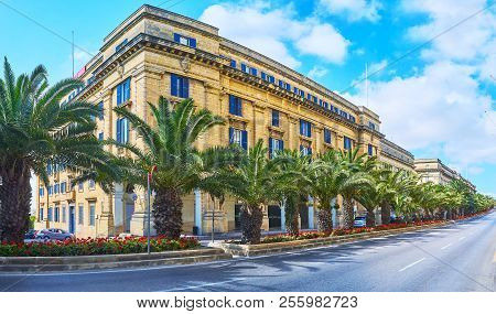 Panorama Of St Anne Avenue With Long Row Of Palms And Flower Beds Along The Road, Floriana, Malta.