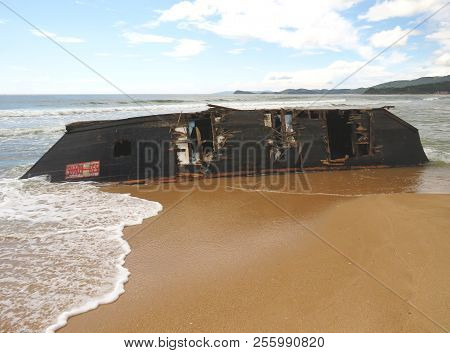 Nakhodka.primorsky Kray / Russia - August 31 2018: Wrecked North Korean Fishing Boat On The Beach Of