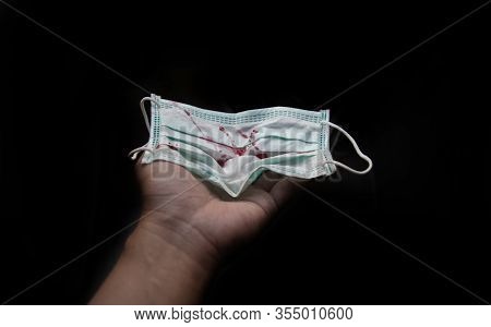 Blood On Medical In Red Bagon Hand In Virus Situation On Black