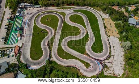 Aerial View Of A Carting Track With A Lone Driver