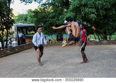 Bagan, Myanmar - Nov 15, 2019: Burmese Men Playing The Traditional Ball Game Of Myanmar: Chinlone.