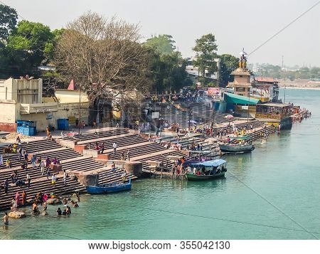 Rishikesh, India - Circa April 2018. People Bathing On The Ganga Riverbank In Rishikesh.