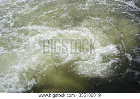 The Rapid Flow Of Water Foams And Boils. Vertiginous Current. Dangerous Concept.
