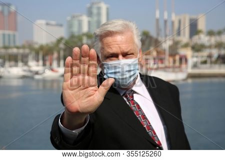 Coronavirus outbreak. COVID-19. A man wears a Paper Face Mask to avoid contamination of the dreaded Coronavirus2019.  