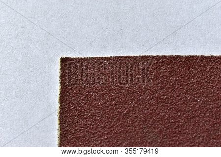 Red Rough Surface Of Sandpaper Close Up