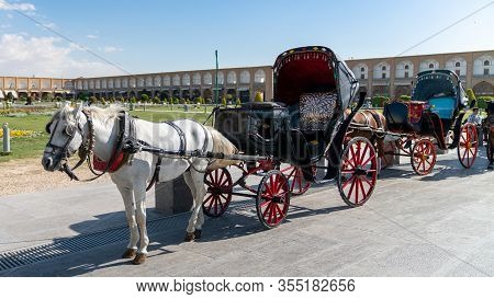 Isfahan, Iran - May 2019: Horse Carriage Ride Waiting In Isfahan Naqsh-e Jahan Square Also Called Im