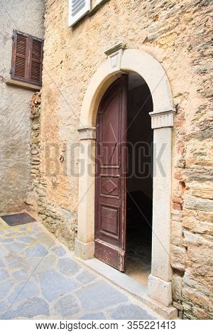 Open church door in French village Casinca